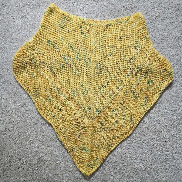 A cowlette knit in yellow yarn with two brioche patterns and two slipped stitch bands