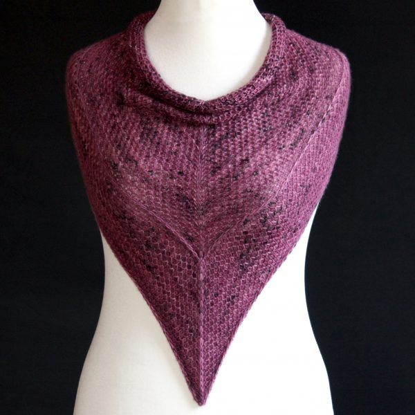 A cowlette knit in purple yarn with two brioche patterns and two slipped stitch bands